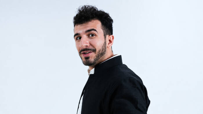 Aram Shkur in a black jacket