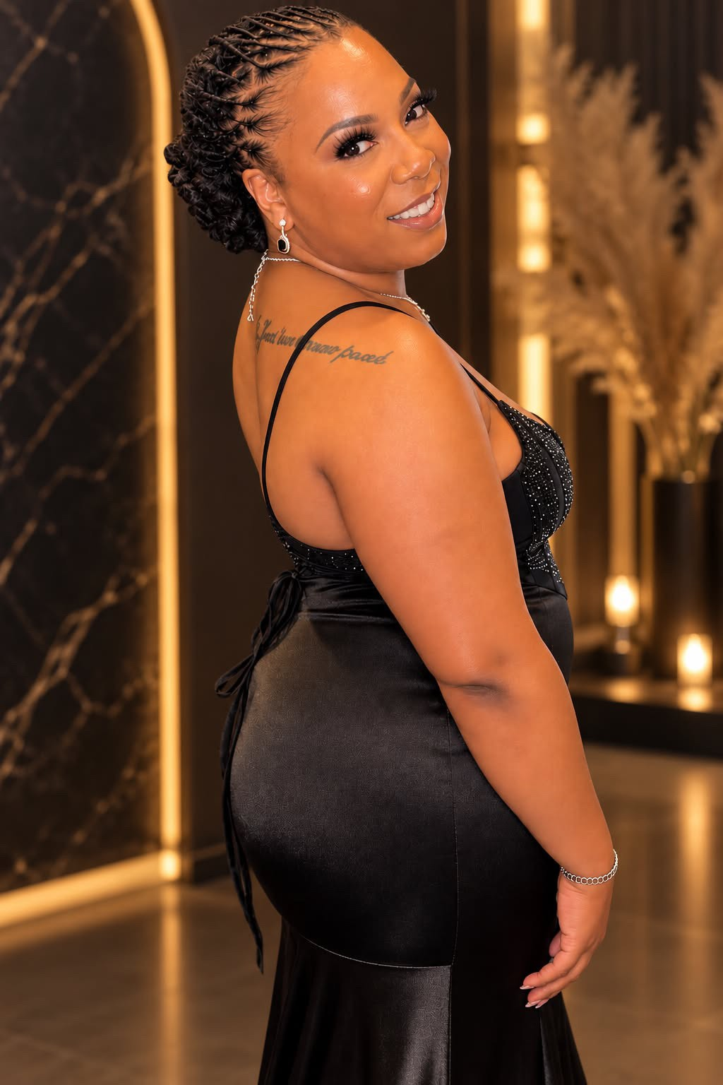 Navita, also known as V, in a black dress.