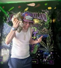 Stevieontay Burnz beside his Southern Maryland Experience display