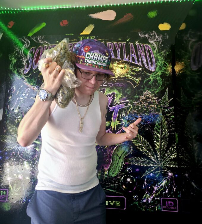 Stevieontay Burnz beside his Southern Maryland Experience display