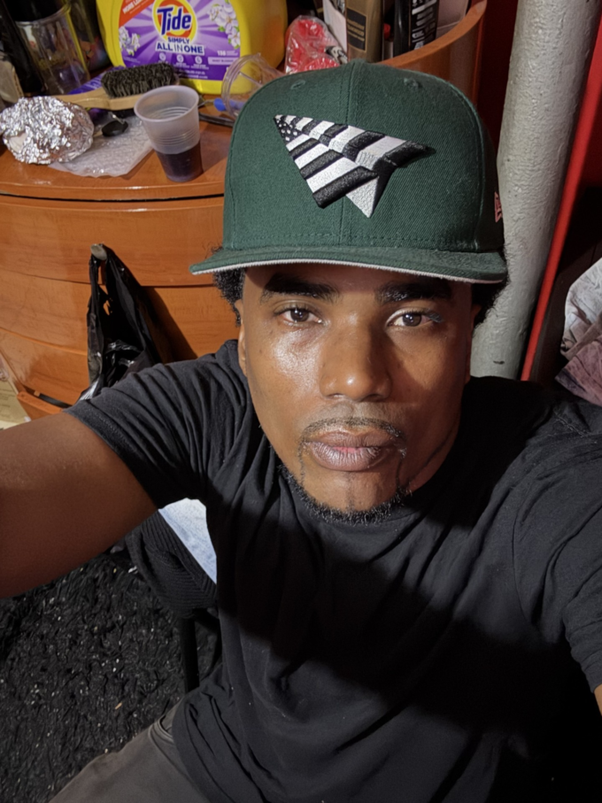 Neus Pacino wearing a green cap and black shirt — supplied artist portrait
